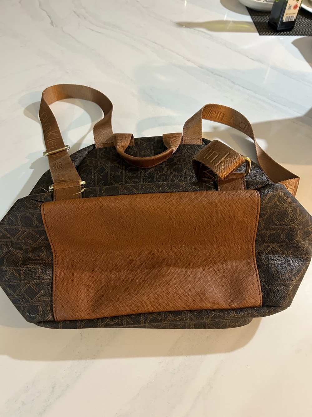 Calvin Klein Brown Monogram Canvas Backpack with Tan Leather Accents